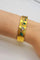 Bracelet Bracelet vintage années 1970 en or jaune 20 carats, diamants et émeraudes 58 Facettes