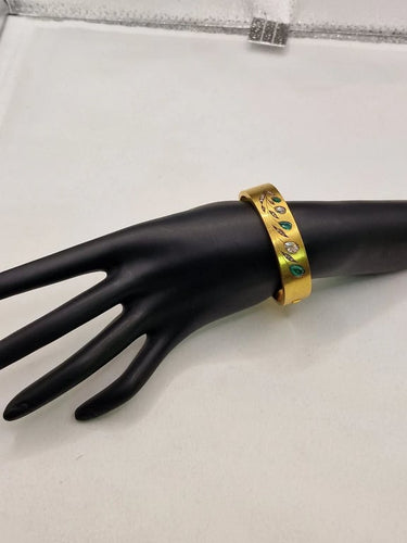 Bracelet Bracelet vintage années 1970 en or jaune 20 carats, diamants et émeraudes 58 Facettes