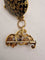Montre Baume & Mercier - Broche montre en or jaune 18 carats et émail 58 Facettes