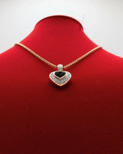 Pendentif Pendentif cœur en or bicolore 750/000, saphirs et diamants 58 Facettes 250253