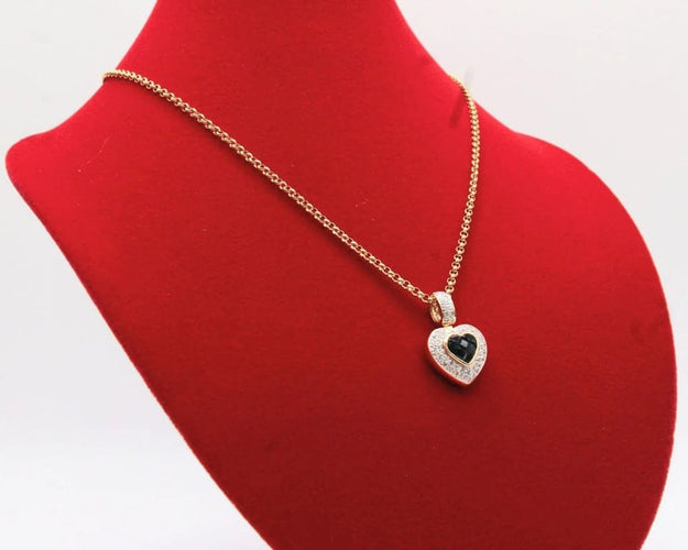 Pendentif Pendentif cœur en or bicolore 750/000, saphirs et diamants 58 Facettes 250253