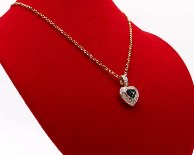 Pendentif Pendentif cœur en or bicolore 750/000, saphirs et diamants 58 Facettes 250253