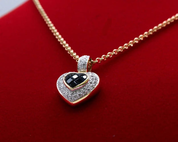 Pendentif Pendentif cœur en or bicolore 750/000, saphirs et diamants 58 Facettes 250253