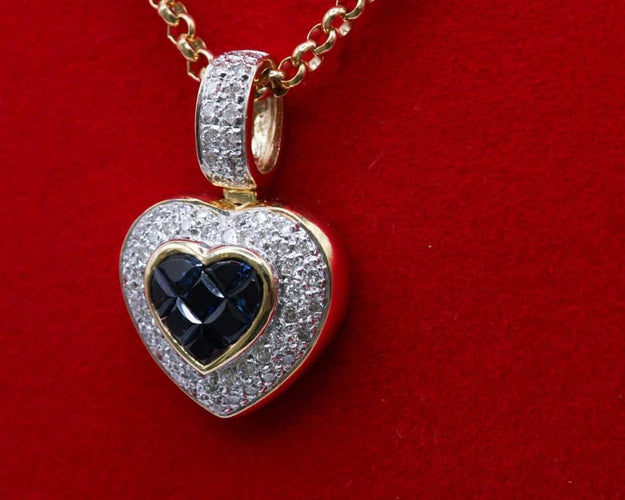 Pendentif Pendentif cœur en or bicolore 750/000, saphirs et diamants 58 Facettes 250253