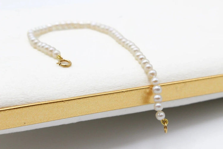 Bracelet Bracelet perles d’eau douce avec fermoir en or jaune 750 58 Facettes 250129
