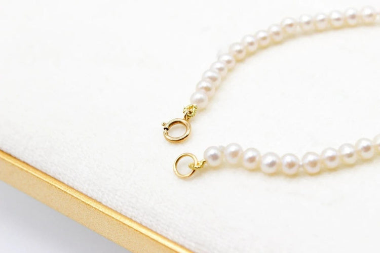 Bracelet Bracelet perles d’eau douce avec fermoir en or jaune 750 58 Facettes 250129