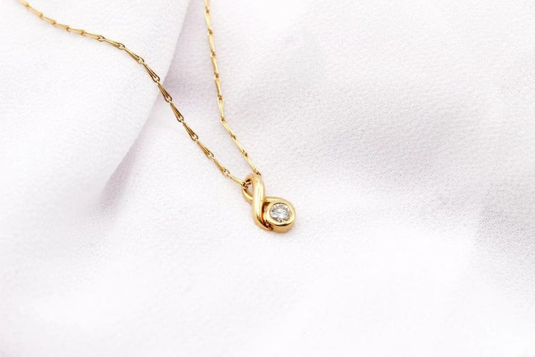 Pendentif Pendentif boucle en or jaune 18 carats et diamant 58 Facettes 250437
