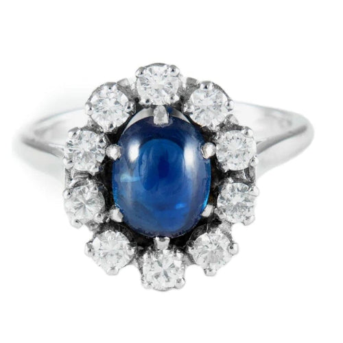 Bague 52 Bague marguerite ancienne en or blanc et platine, saphir cabochon et diamants 58 Facettes
