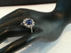 Bague 52 Bague marguerite ancienne en or blanc et platine, saphir cabochon et diamants 58 Facettes