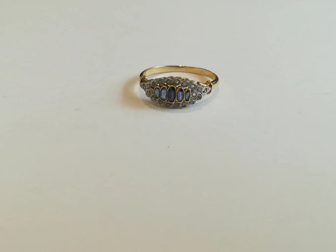 Bague 56 Bague jarretière ancienne en or jaune et or blanc, saphirs et diamants 58 Facettes