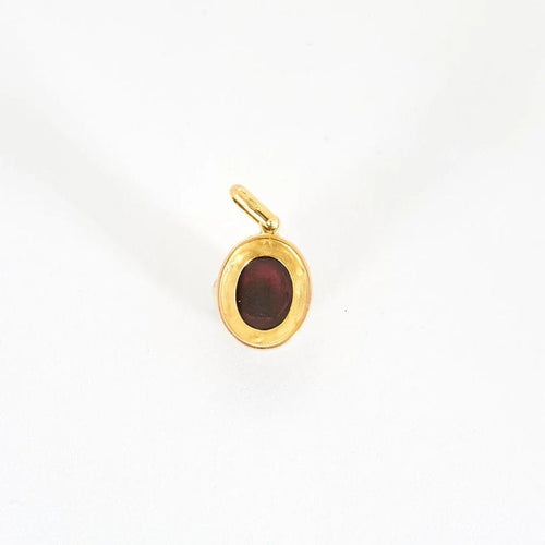 Pendentif Pendentif ancien en or jaune 18 ct, grenat cabochon et diamants 58 Facettes