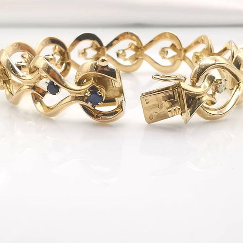 Bracelet Bracelet en or jaune 18 carats avec diamants et saphirs 58 Facettes