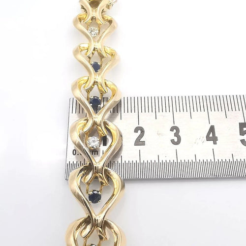 Bracelet Bracelet en or jaune 18 carats avec diamants et saphirs 58 Facettes