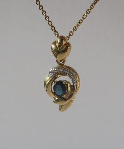 Pendentif Pendentif cœur bicolore en or 18 carats et saphir 58 Facettes