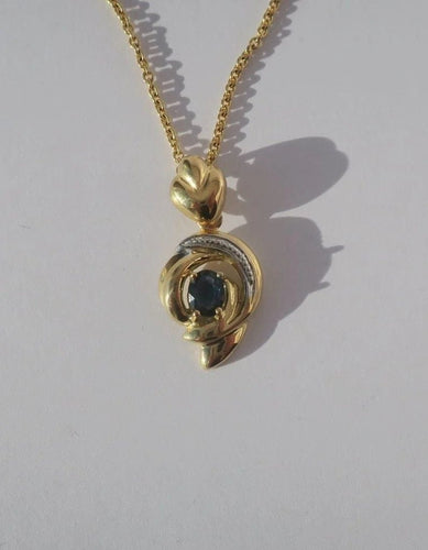 Pendentif Pendentif cœur bicolore en or 18 carats et saphir 58 Facettes