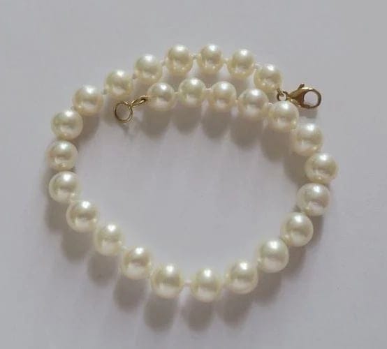 Bracelet Bracelet en or jaune et perles de culture 58 Facettes