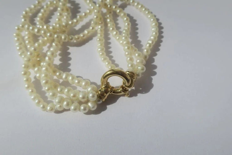 Bracelet Bracelet quatre rangs en or jaune et perles de culture 58 Facettes
