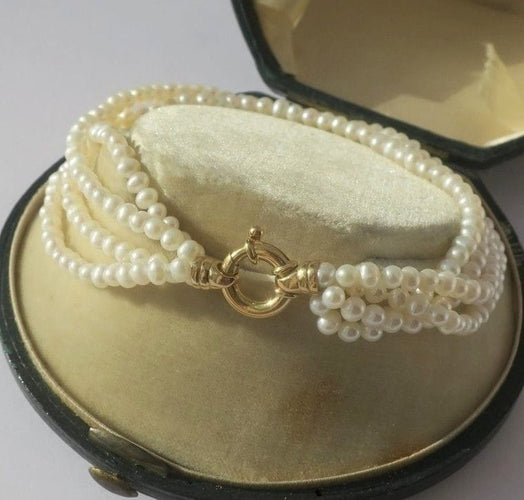 Bracelet Bracelet quatre rangs en or jaune et perles de culture 58 Facettes