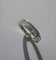 Bague 50.5 Bague alliance demi-tour en or blanc 18 carats et diamants 58 Facettes