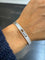 Bracelet Messika Move Noa - Bracelet jonc semi-pavé en or blanc et diamants 58 Facettes 1.0000887/2