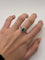 Bague 52 Bague en or blanc 18K sertie d’une émeraude 1 ct et diamants 58 Facettes