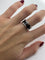 Bague 52 Cartier - Bague vintage C de Cartier en or blanc 58 Facettes 1061