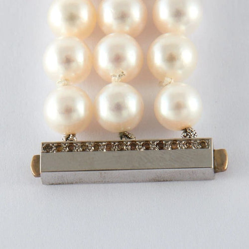 Bracelet Bracelet papillon en or blanc et or jaune avec perles Akoya et diamants 58 Facettes