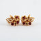 Boucles d'oreilles Boucles d’oreilles fleurs à clip en or jaune 18k, rubis birmans et diamants 58 Facettes 2.165