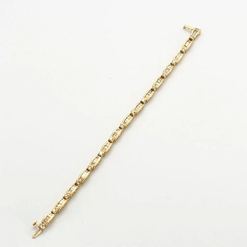 Bracelet Bracelet en or jaune 18k serti de diamants taille baguette 58 Facettes 1