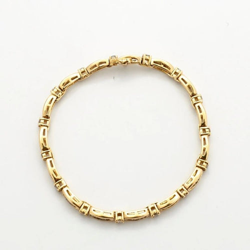 Bracelet Bracelet en or jaune 18k serti de diamants taille baguette 58 Facettes 1