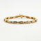 Bracelet Bracelet en or jaune 18k serti de diamants taille baguette 58 Facettes 1