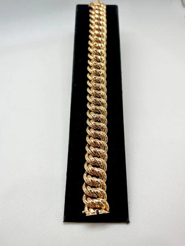 Gourmette maille américaine en or jaune 18k 58 Facettes M9087