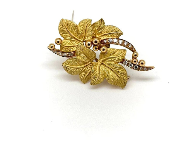 Broche Broche 4 feuilles en or jaune 18k et diamants 58 Facettes M9152