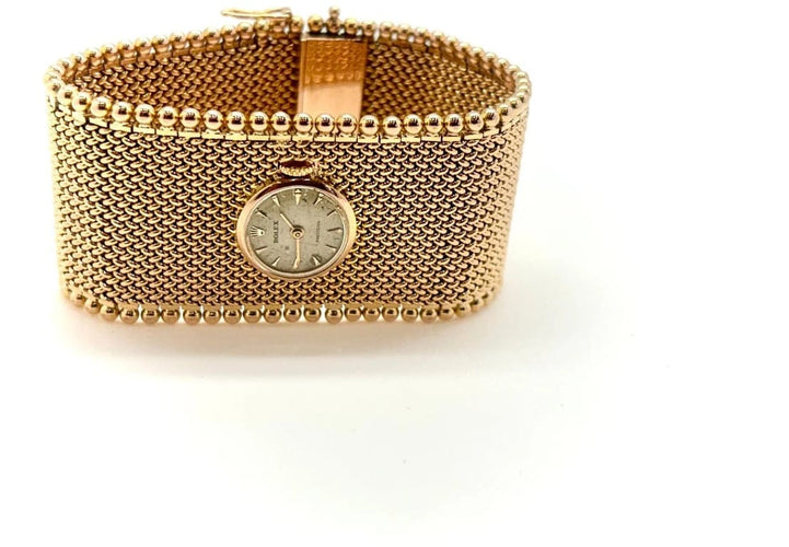 Montre Rolex - Montre bijou avec bracelet manchette en or jaune 18k 58 Facettes M9294