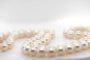 Collier Collier de perles de culture blanches avec fermoir en or 18 carats 58 Facettes