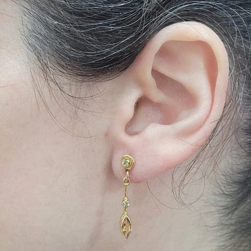 Boucles d'oreilles Boucles d’oreilles en or jaune 18 carats, citrines et péridots 58 Facettes PE780