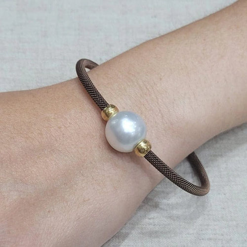 Bracelet Bracelet en acier brun avec perle australienne 58 Facettes PUV209