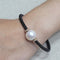 Bracelet Bracelet en acier noir et or rose avec perle australienne et diamants 58 Facettes puv363