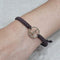 Bracelet Bracelet symbole de paix en macramé avec motif en or rose 18 carats et diamants 58 Facettes P174