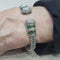 Bracelet Bracelet en or blanc 18 carats, tsavorites et diamants taille brillant 58 Facettes P76