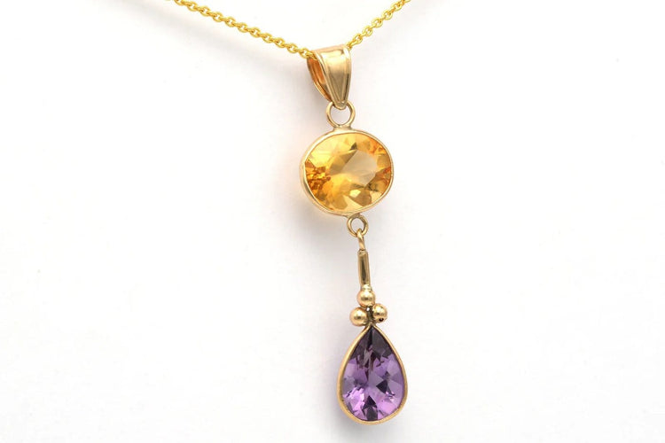Pendentif Pendentif contemporain en or jaune 14 carats, améthyste et citrine 58 Facettes 23048