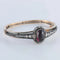 Bracelet Bracelet en or et argent au grenat cabochon et diamants 58 Facettes