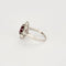 Bague 52 Bague marguerite en platine et or blanc, rubis et diamants 58 Facettes