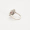 Bague 52 Bague marguerite en platine et or blanc, rubis et diamants 58 Facettes