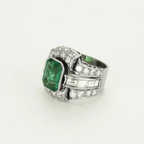 Bague 52 Bague Art déco en platine et or jaune, diamants et émeraude 58 Facettes