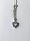 Collier Collier cœur en or blanc et diamants 58 Facettes 203