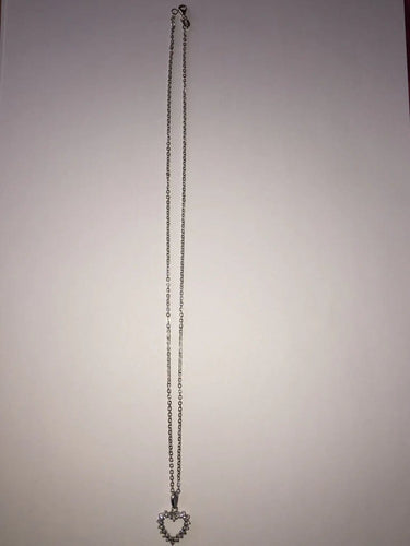 Collier Collier cœur en or blanc et diamants 58 Facettes 203