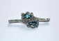 Broche Broche rétro en or gris 18 carats, aigues-marines et diamants 58 Facettes 580