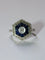 Bague 56 Bague Art déco hexagonale en or blanc et platine, diamants et saphirs 58 Facettes 156
