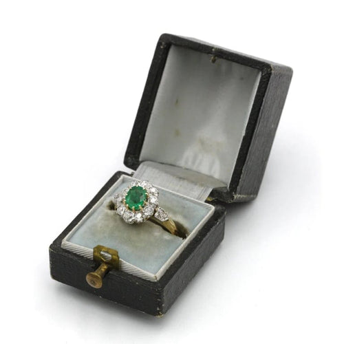 Bague 47 Bague marguerite en or jaune, platine, émeraude et diamants 58 Facettes 1192